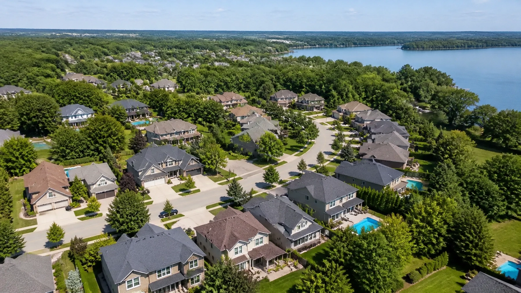 An aerial drone shot of a quiet, upscale residential neighbourhood in Simcoe County, Ontario.
